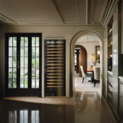 A luxurious living room with one Transtherm wine fridge stored in custom millwork.
