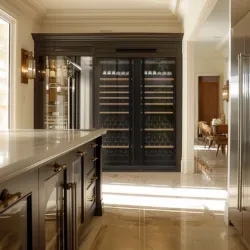A luxurious kitchen with two Transtherm wine fridges stored in custom millwork.