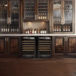 A modern living space with two small Transtherm wine fridges in custom millwork.