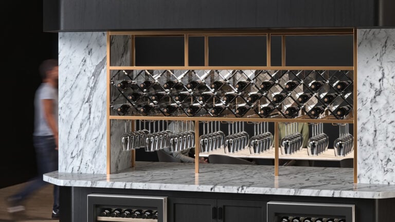 Custom Acrylic Grid Wine Rack by VintageView in a restaurant.
