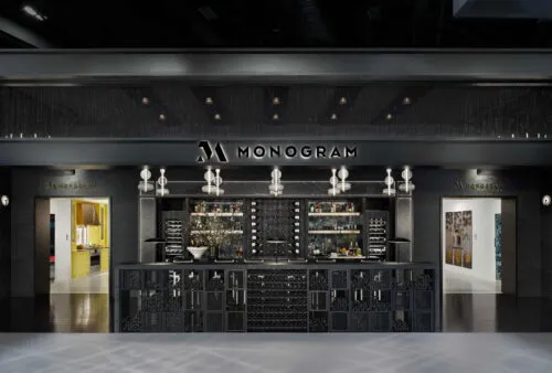 The 2024 Monogram Appliances trade show booth featuring Vino Pins and Case and Crate bulk storage.