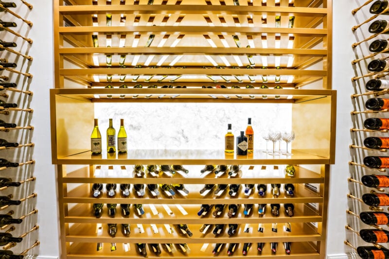Label-forward wine bottle storage on a custom VintageView Forged racking system, installed by Red Leaf Wine Cellars and Saunas