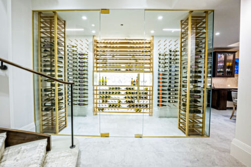 Label-forward wine bottle storage on a custom VintageView Forged racking system, installed by Red Leaf Wine Cellars and Saunas