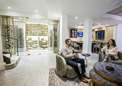 Label-forward wine bottle storage on a custom VintageView Forged racking system, installed by Red Leaf Wine Cellars and Saunas