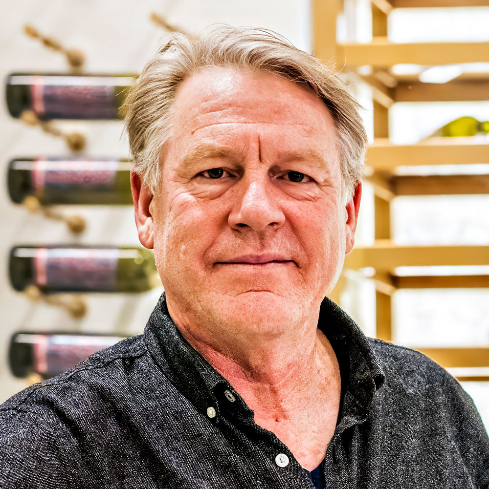 Label-forward wine bottle storage on a custom VintageView Forged racking system, installed by Red Leaf Wine Cellars and Saunas