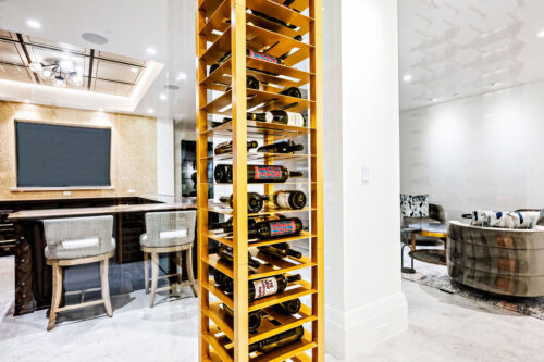 Label-forward wine bottle storage on a custom VintageView Forged racking system, installed by Red Leaf Wine Cellars and Saunas