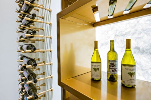 Label-forward wine bottle storage on a custom VintageView Forged racking system, installed by Red Leaf Wine Cellars and Saunas