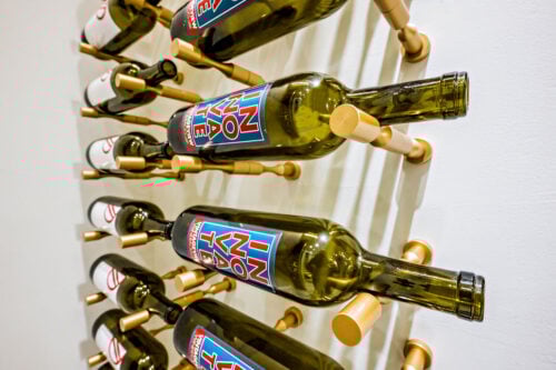 Label-forward wine bottle storage on a custom VintageView Forged racking system, installed by Red Leaf Wine Cellars and Saunas